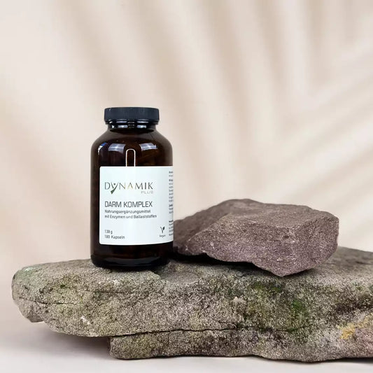 Brauner Glasbehälter mit DynamikPlus "Darm Komplex" Etikett und schwarzem Drehverschluss