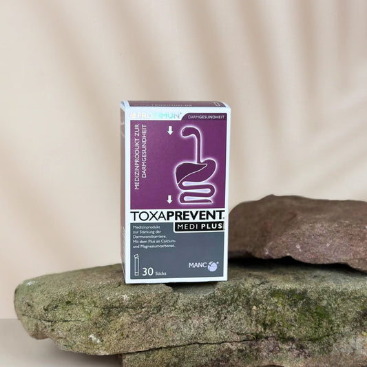 Rechteckige violet-weiße Verpackung mit "TOXAPREVENT Medi Plus" Print und Verdauungstraktabbildung 