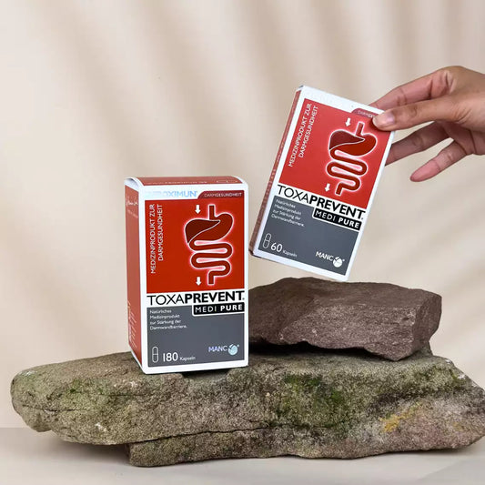 Rechteckige rot-weiße Verpackung mit "TOXAPREVENT Medi Pure" Print und Verdauungstraktabbildung 